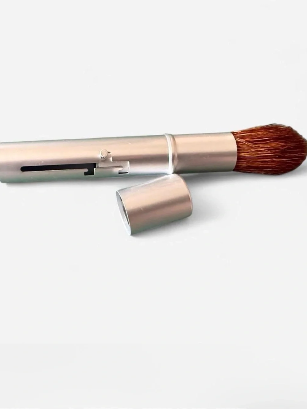 I.d. Bare Escentials retractable travel makeup Brush.